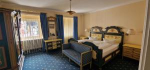 Cama o camas de una habitación en PRISMA Parkhotel Wehrle