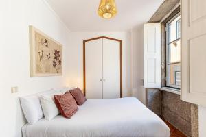 Postel nebo postele na pokoji v ubytování Casa da Sé by Sé Apartamentos + 16 fotografií