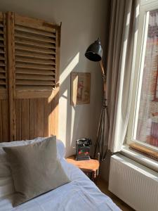 Giường trong phòng chung tại B&B Le flaneur