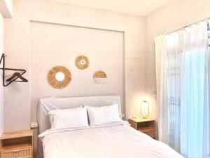 Postel nebo postele na pokoji v ubytování Brother Homestay