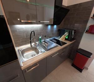 a kitchen with a sink in a small room at Mini Suite 35 qm in Valle Gran Rey +4 photos