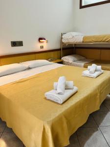 Postel nebo postele na pokoji v ubytování Hotel Columbia Frontemare