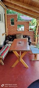 a picnic table and bench on a patio at Balassa House in Siófok