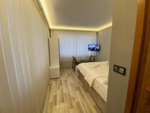 Postel nebo postele na pokoji v ubytování Yamaç Çam Hotel