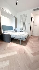 Ein Bett oder Betten in einem Zimmer der Unterkunft Appartamento Central Park - Affitti Brevi Italia
