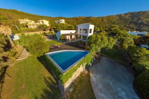 an aerial view of a house with a swimming pool at Livingtarifa - Casa Los Helechos in El Bujeo