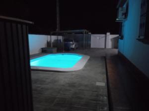 a swimming pool in a dark room at night at Chalet Aquí No Es in Chiclana de la Frontera +23 photos