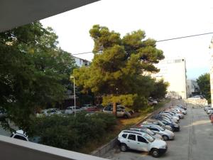 a row of cars parked in a parking lot at Apartment Italiano in Split