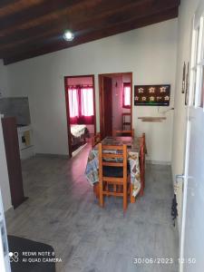 a room with a table and a room with a bedroom at Departamento Rosales Nro 2 in Valeria del Mar +15 photos