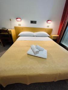 Postel nebo postele na pokoji v ubytování Hotel Columbia Frontemare