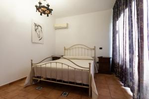 سرير أو أسرّة في غرفة في Azienda Agricola Agri Bio Serv