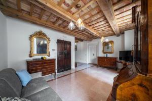 a living room with a couch and a tv at [Luxury House] Palazzo Signorile in Centro in Civitanova Alta