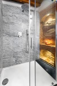a shower with a glass door in a bathroom at [Luxury House] Palazzo Signorile in Centro in Civitanova Alta