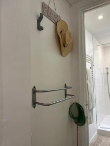 a bathroom with a hat hanging on the wall at "Chez Anne à la Plage" Studio à 150 m de la Plage in Trouville-sur-Mer