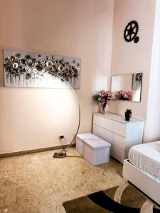 a bedroom with a mirror and a bed and a table at Sina Rent Room in Rome