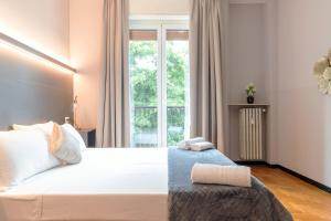 Кровать или кровати в номере Milan Retreats