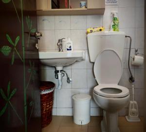 a bathroom with a toilet and a sink at Jenny's House in Yerakiní
