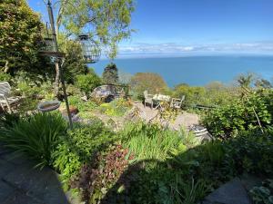 a garden with a view of the water at North Walk House in Lynton