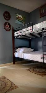 a bedroom with two bunk beds in a room at Jenny's House in Yerakiní