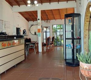 a kitchen and dining room with a table and chairs at HOTEL CASA COLONIAL in San Antonio del Táchira