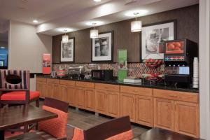a fast food restaurant with a counter and tables and chairs at Countryside Inn Jackson in Jackson +20 photos