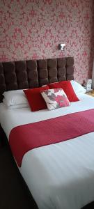 Ένα ή περισσότερα κρεβάτια σε δωμάτιο στο Lawnswood Guest House