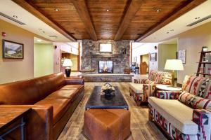 a living room with a couch and a fireplace at Homewood Suites by Hilton Kalispell in Kalispell