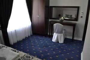 Postel nebo postele na pokoji v ubytování Hotel Emi
