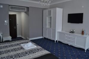 Postel nebo postele na pokoji v ubytování Hotel Emi