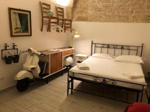 Postel nebo postele na pokoji v ubytování La piccola casa di Tania in via Fiore