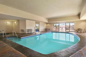 a large pool with blue water in a hotel room at Hampton Inn & Suites Lawton in Lawton