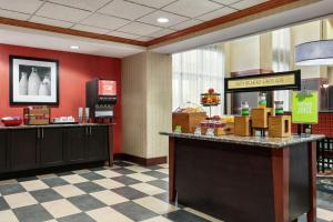 a fast food restaurant with a cash counter in a store at Hampton Inn & Suites Lawton in Lawton
