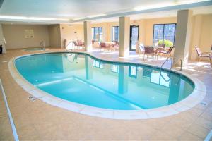 a large swimming pool in the middle of a building at Hampton Inn Lewisburg in Lewisburg