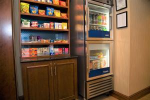 a refrigerator with its doors open with food inside at Hampton Inn Lewisburg in Lewisburg