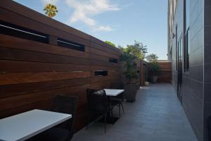 a patio with tables and chairs in a restaurant at Hampton Inn & Suites Sherman Oaks in Sherman Oaks