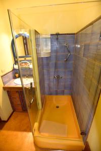 a bathroom with a shower and a sink at Villa Caribeña in Las Galeras