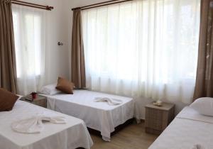 Postel nebo postele na pokoji v ubytování Agan Pension