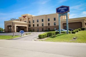 a sign for a hyundai clinic in front of a building at Hampton Inn Morehead in Morehead