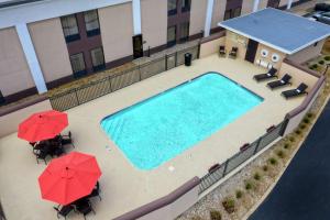 an overhead view of a swimming pool with umbrellas at Hampton Inn Winchester KY in Winchester