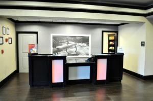 a room with two tables with lights on it at Hampton Inn & Suites Bay City in Bay City