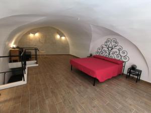 En eller flere senge i et værelse på La Volta di Gatto