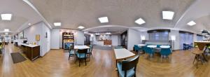 a cafeteria with tables and chairs in a building at Hampton Inn LaPorte in LaPorte