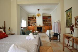 a bedroom with a bed and a living room at tuGuest Hortichuela House in Ugíjar +52 photos