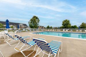 a group of chairs and a swimming pool at Fairway Village - 136 Augusta Dr #26 in Ocean View