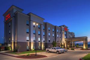 a hotel with a car parked in front of it at Hampton Inn & Suites Big Spring in Big Spring