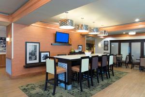 a dining room with a large table and chairs at Hampton Inn & Suites Mansfield South @ I 71 in Mansfield
