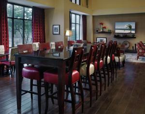 a dining room with a table and chairs at Hampton Inn & Suites Millington in Millington
