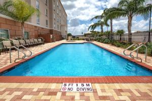 a swimming pool with a no diving sign in front of a building at Hampton Inn & Suites McAllen in McAllen