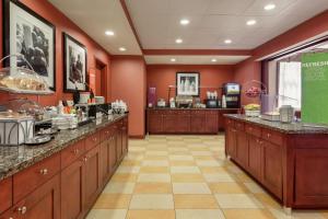 a large room with a hair salon with a counter at Hampton Inn & Suites Prattville in Prattville