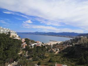 a view of a large body of water with buildings at Apartamentos Bon Amb in Faro de Cullera